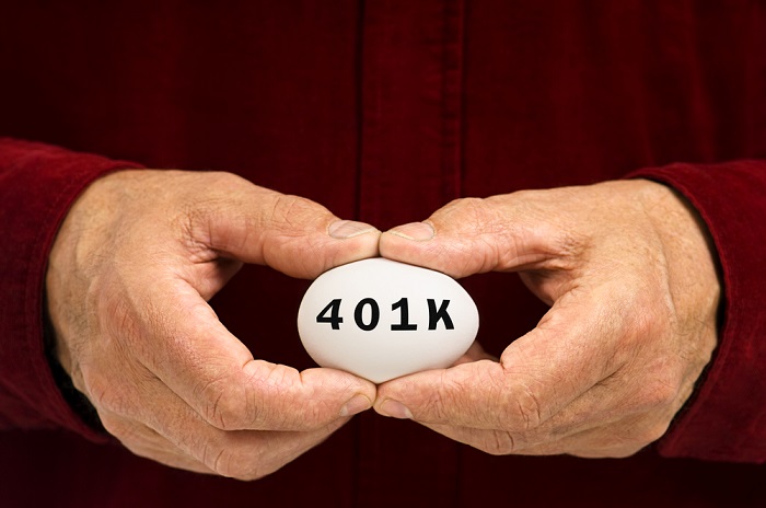 Hands holding egg with 401k written on it