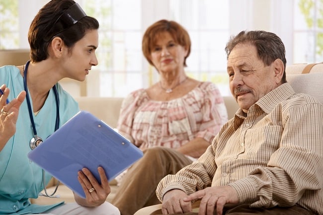 older man and woman with nurse