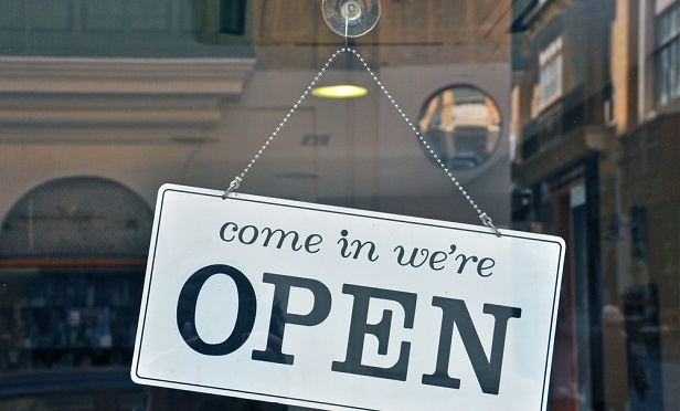 Open sign in store window