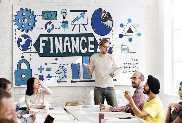 man giving presentation on finances