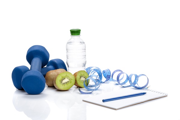 Weights, water bottle and wellness plan