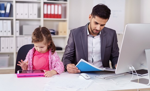 Father with daughter at work