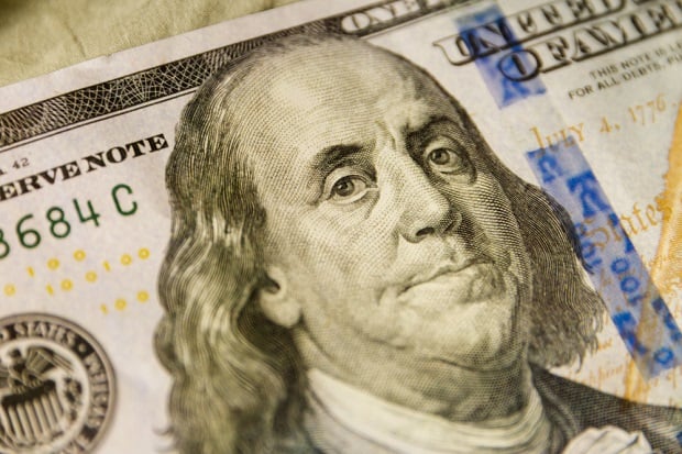 closeup of B. Franklin on money