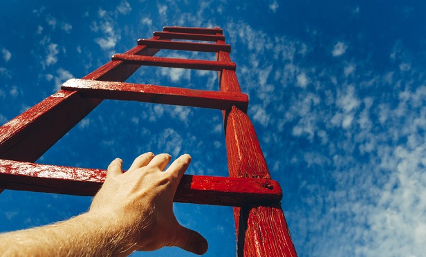 Hand reaching up ladder