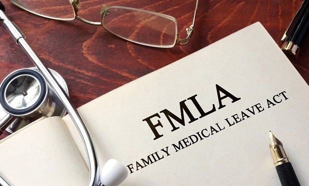 Paper with paid family medical leave written on it