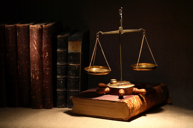 legal books with scale of justice