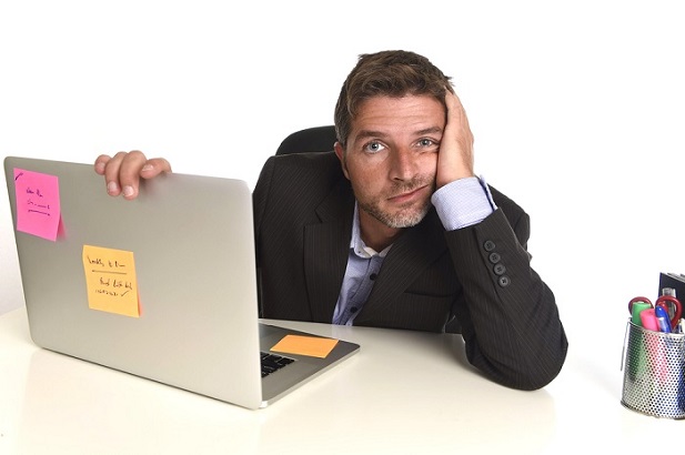 stressed man with laptop