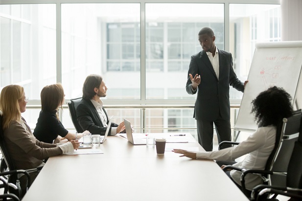man giving presentation to group