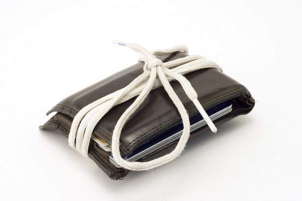 shoestring tied around wallet
