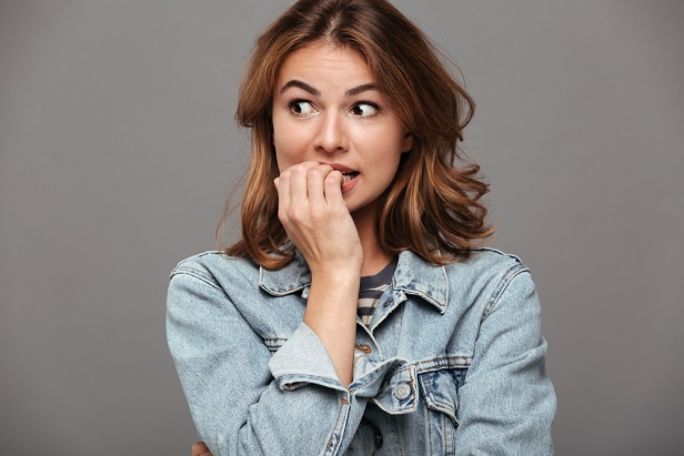 woman biting fingernails