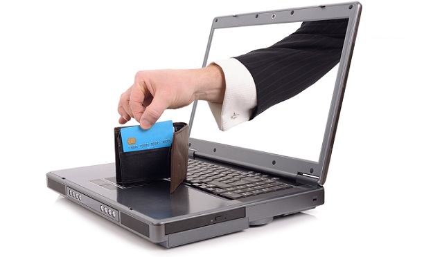 Hand reaching through computer to credit card