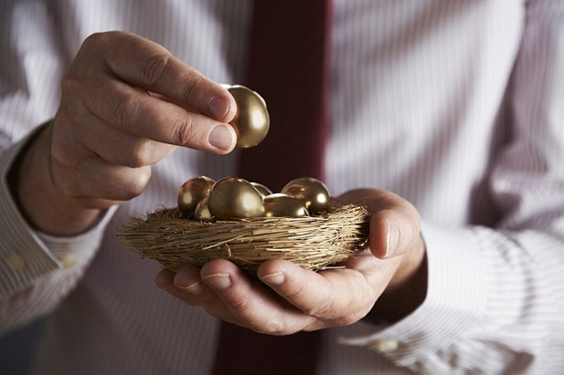 man holding nest with golden egg