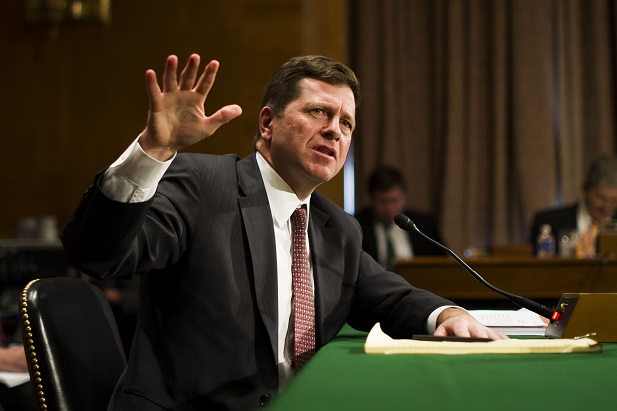 SEC Chair Jay Clayton at his confirmation hearing talking and gesturing