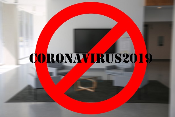 red slash over empty office with word coronavirus on it