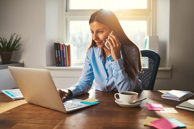 woman at laptop in her home