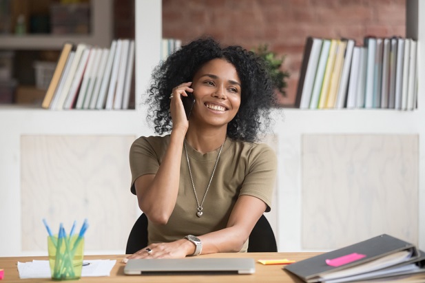 woman advisor on phone in office smiling