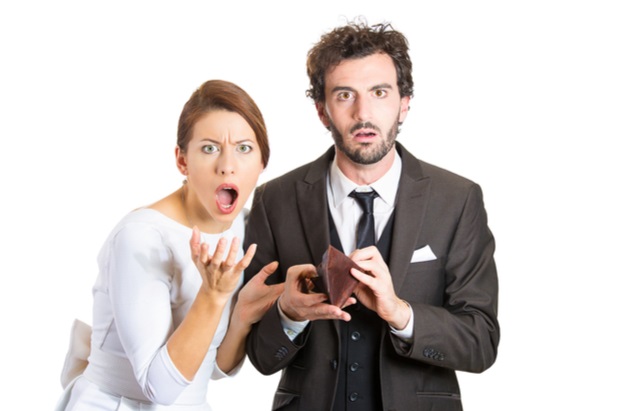 man and woman reacting in extreme dismay with mouths open