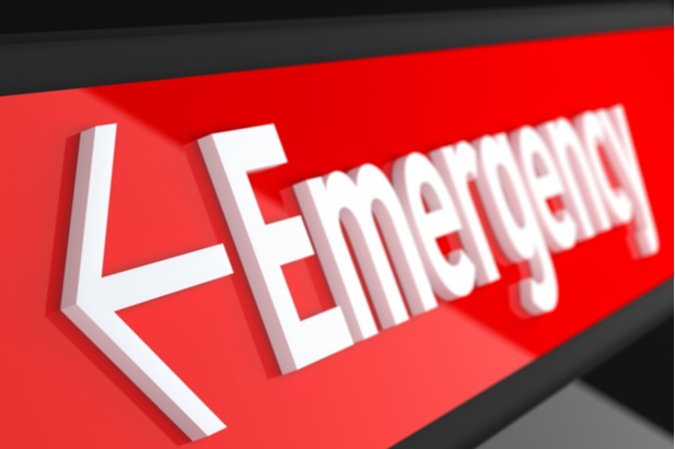 red and white sign says Emergency with an arrow