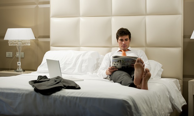 Man relaxing in hotel room