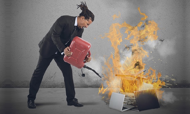 Man starting computers on fire