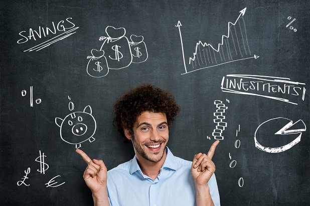man in front of chalkboard pointing to phrases Saving and Investing