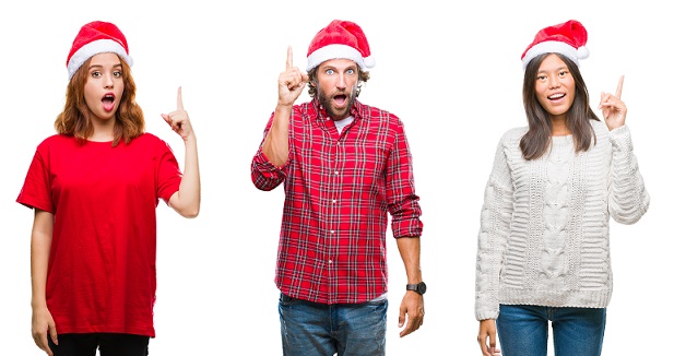 two women and one man in santa hats with finger up as if saying I have an idea