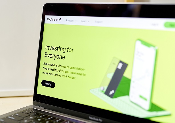 The website home screen for Robinhood is displayed on a laptop computer.