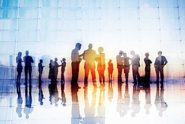 stylized image of business people silhouetted against big window