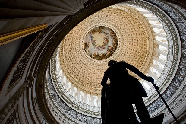 2013 photo looking up inside the U.S. Capitol building rotunda including view of statue