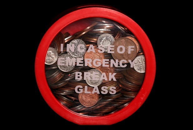 glass box with money in it and break glass in case of emergency message