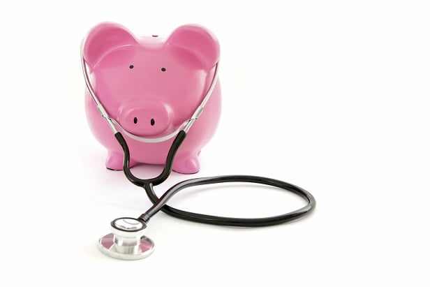 Pink piggy bank with stethoscope on it