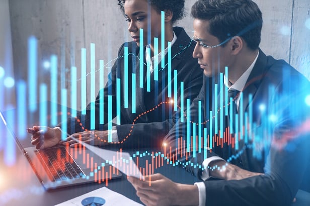 man and woman in business suits with investment charts superimposed over them