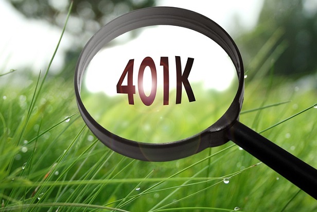 magnifying glass with 401k written on it in front of green field