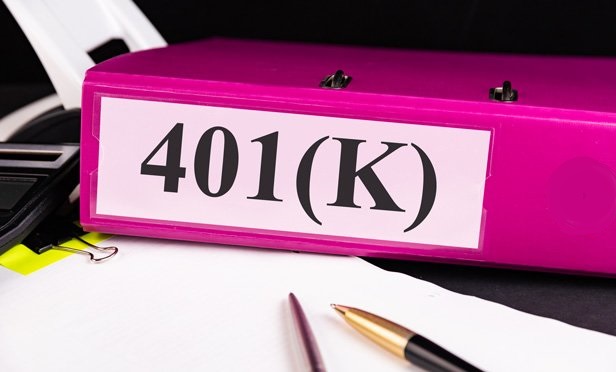 pink notebook binder labeled 401K