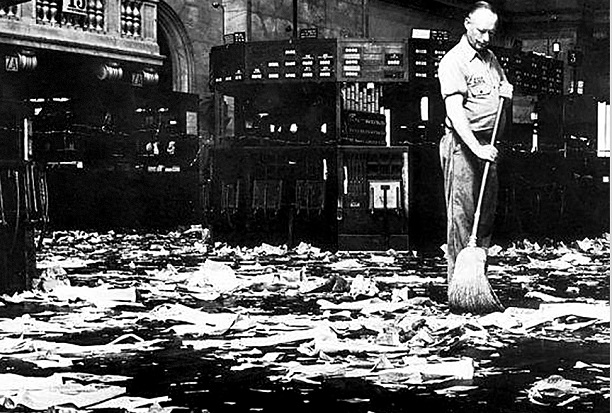 old b and w photo of cleaner sweeping floor after stock crash of 1929