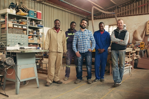 group of men in a workshop