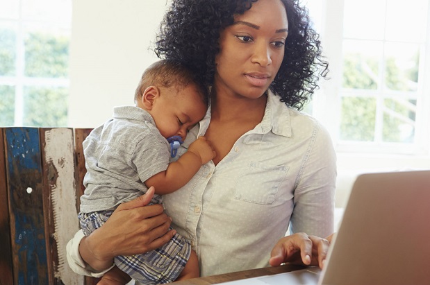 woman and infant at computer