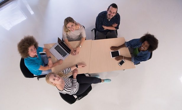 group of employees at meeting seen from above