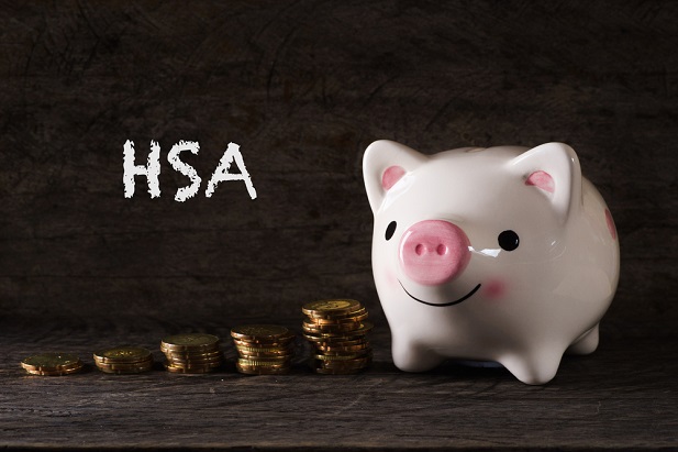 piggy bank, coins and the letters HSA