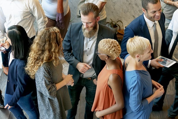 group of people standing and networking