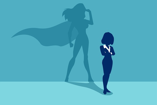 silhouette of woman whose shadow is a super hero