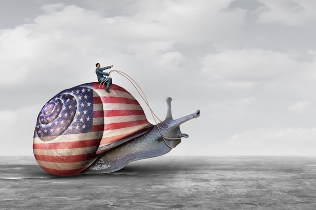 man on giant U.S. flag covered snail