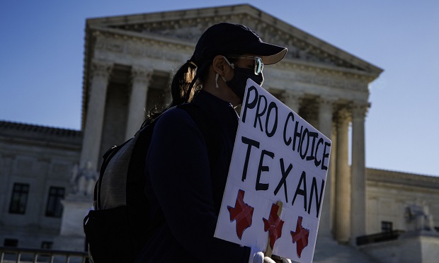 Texas woman holding up pro-choice protest sign