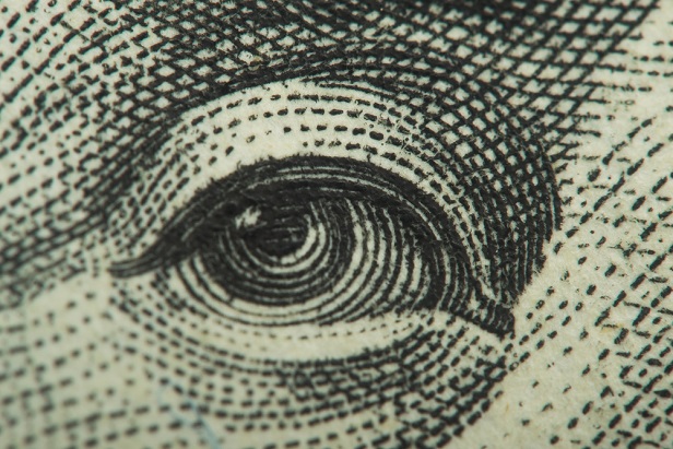 closeup of B Franklin's eye on US currency