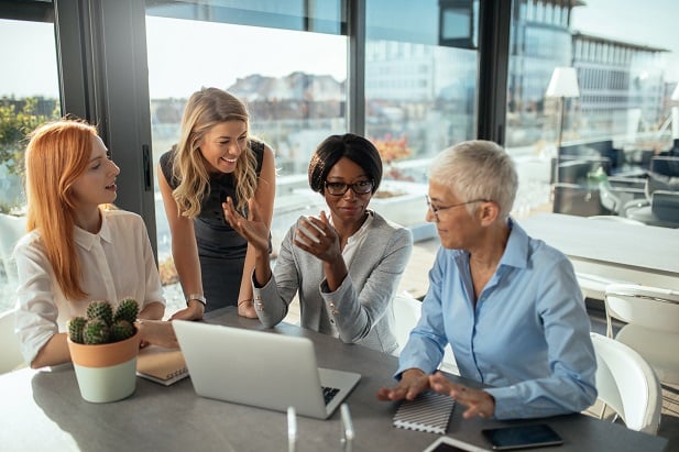 4 women in office meeting