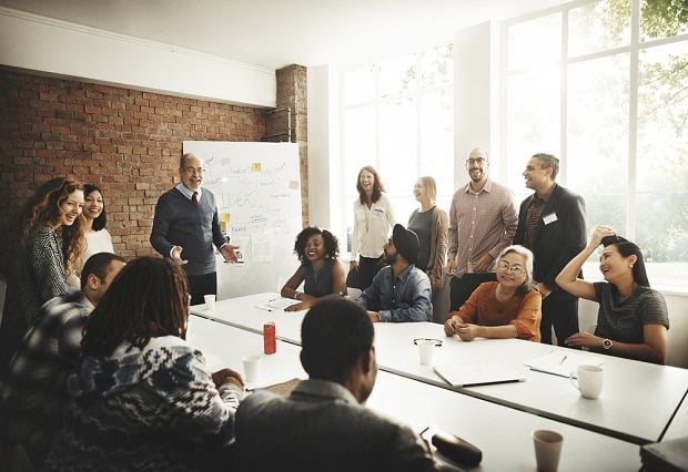 group of diverse people at meeting table.