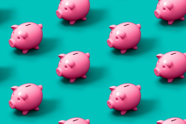 rows of pink piggy banks on a turquoise background