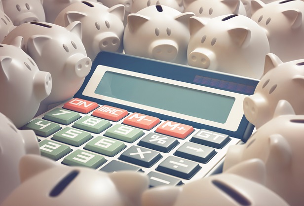 piggy banks surrounding calculator