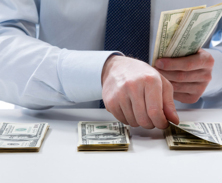 Bank,Teller's,Hands,Counting,Dollar,Banknotes,On,The,Table