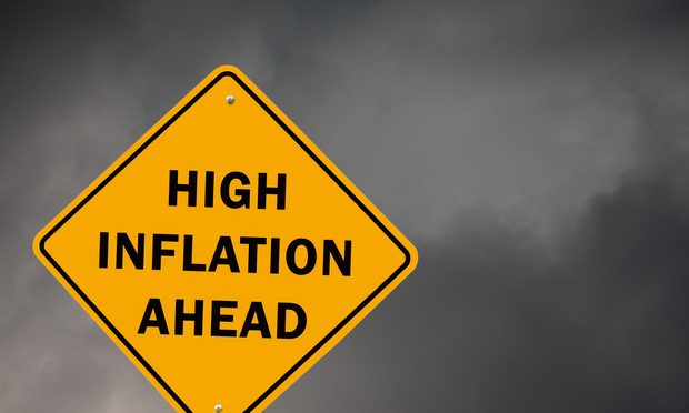 yellow diamond highway sign saying High Inflation Ahead